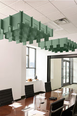 Green 3D cloud-shaped acoustic baffles suspended from ceiling above conference table.