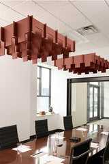 Terracotta 3D baffle panels suspended from ceiling above conference table in office setting.