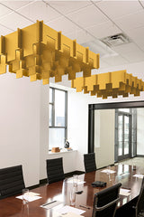 Gold 3D cloud-shaped acoustic baffle panels suspended from ceiling in office meeting room.