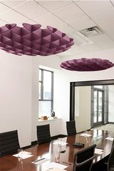Purple 3D cloud-shaped acoustic baffles suspended from white drop ceiling in modern office conference room.