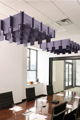 Purple 3D geometric baffle panels suspended from ceiling in modern office conference room.