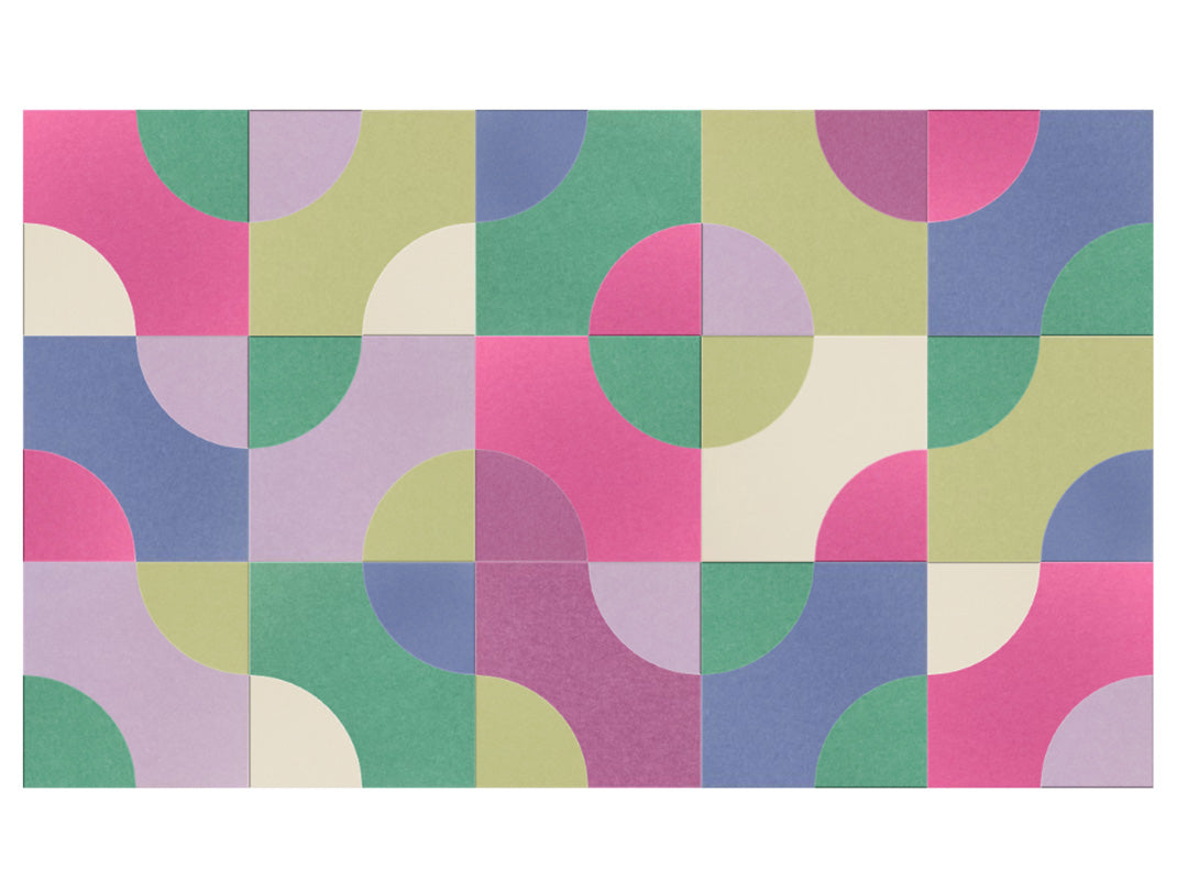 Colorful geometric patterned paper with circular shapes on a white background