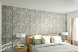 Bedroom with floral wallpaper, wooden headboard, and nightstands with lamps.
