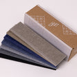 Grey and brown felt samples by cardboard box