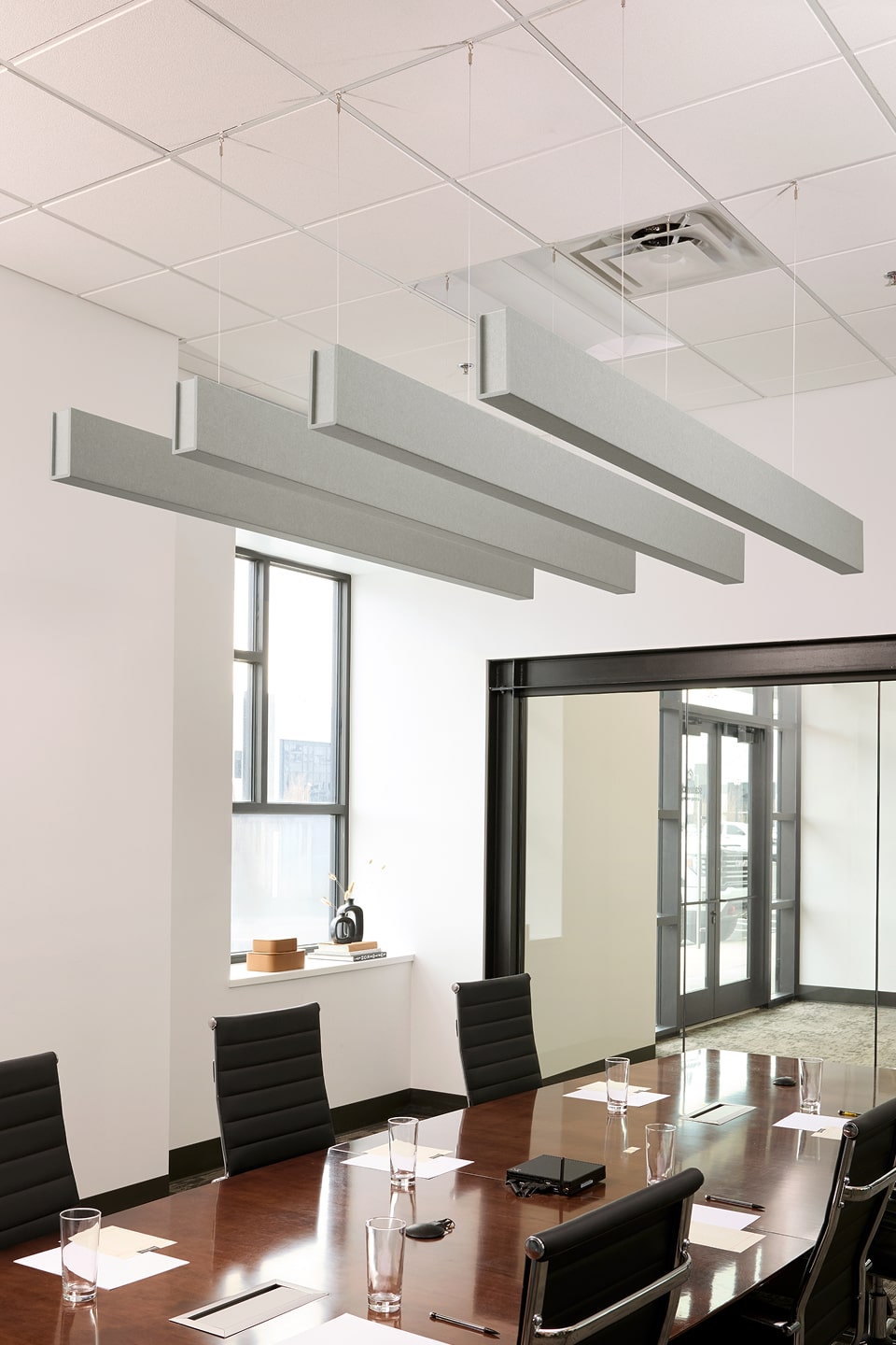 PET felt suspended acoustic beam in Fog by Felt Right absorbs unwanted noise and looks great in any setting. Available in four or eight foot lengths. Clips into ACT grid or drills into drywall ceiling.