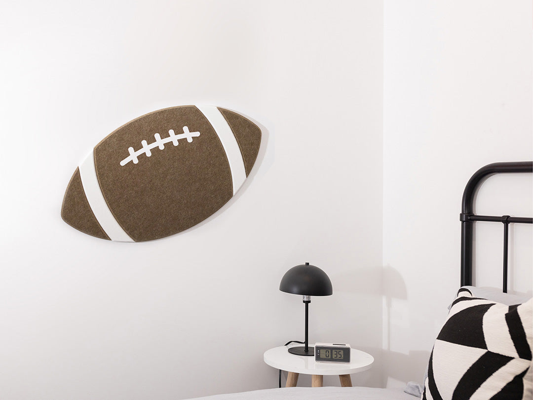 Football wall art next to bed