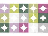Patterned paper with green, purple, and white circles on a white background