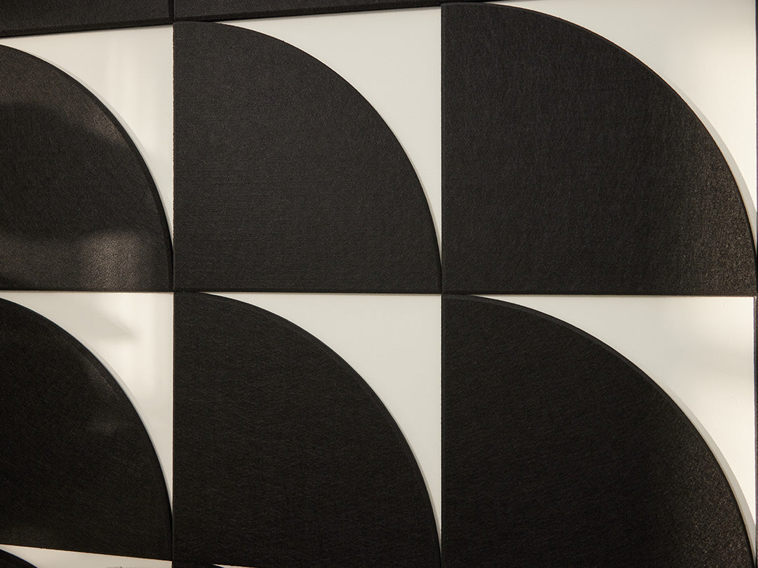 Black circular patterns on a white background