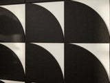 Black circular patterns on a white background
