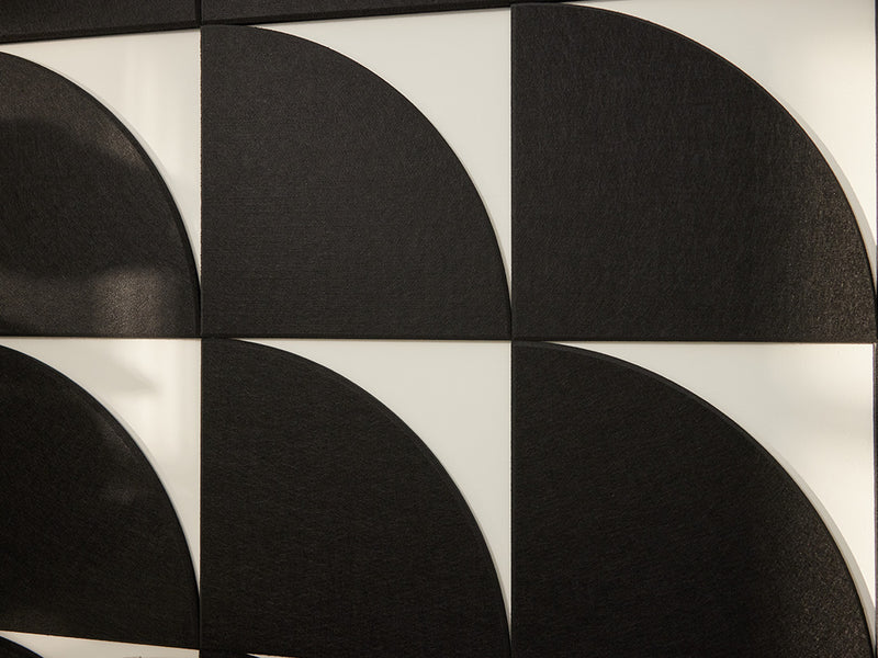 Black circular patterns on a white background