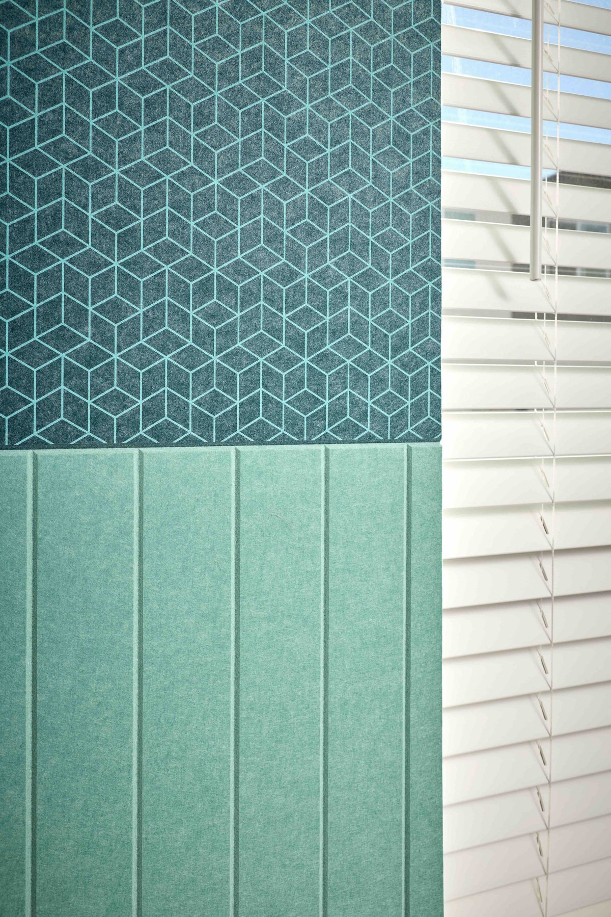Textured green panels with geometric pattern and horizontal slats