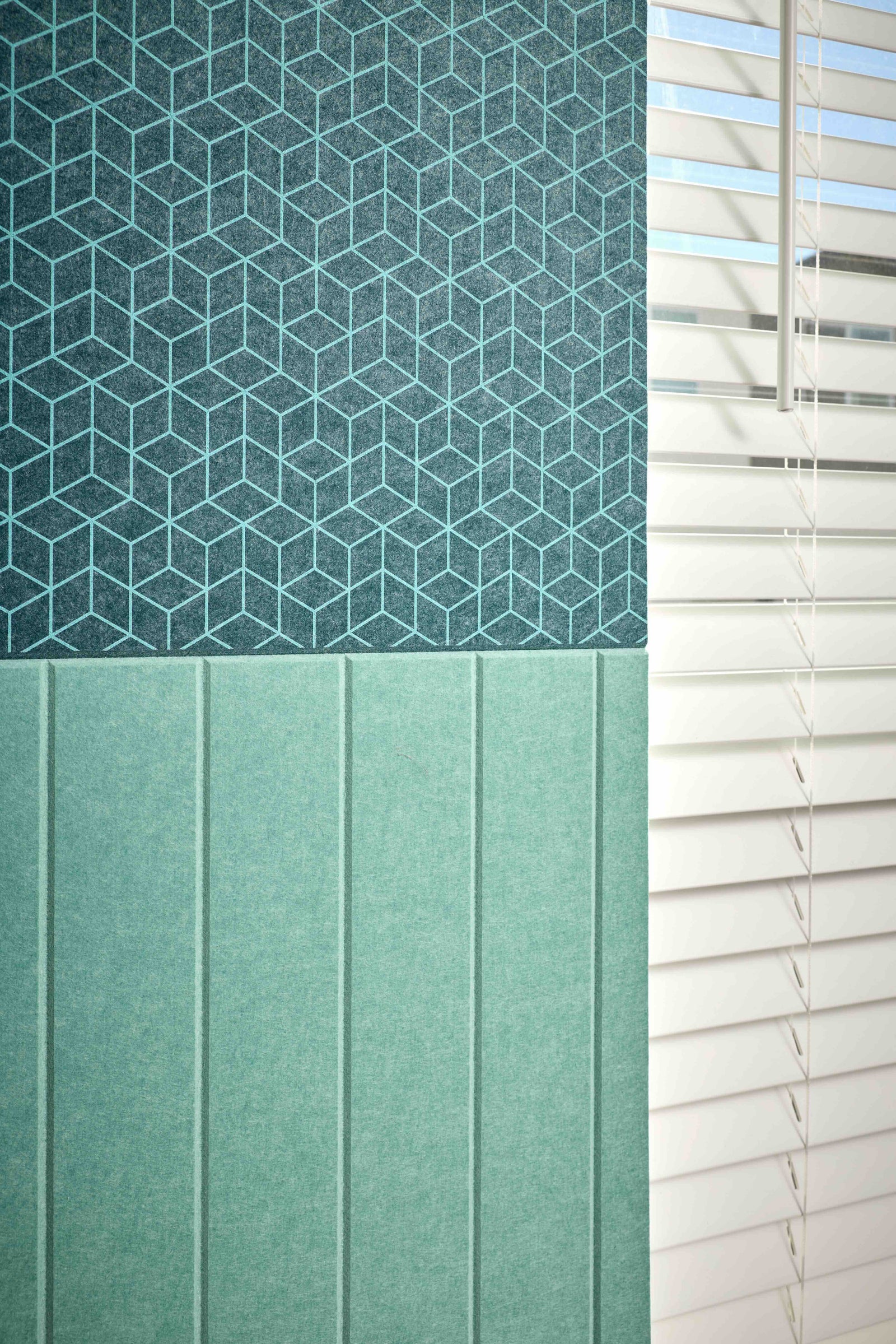 Textured green panels with geometric pattern and horizontal slats