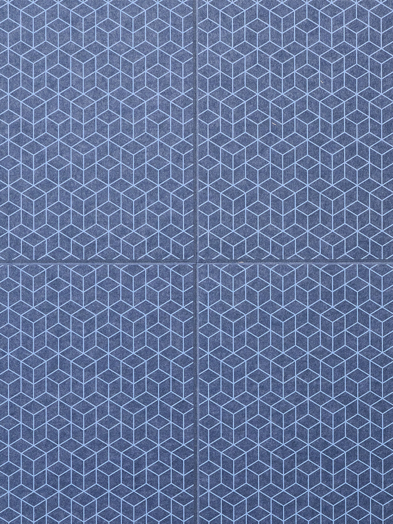 Detailed close up shot of geometric patten on indigo colored felt acoustic wall tiles
