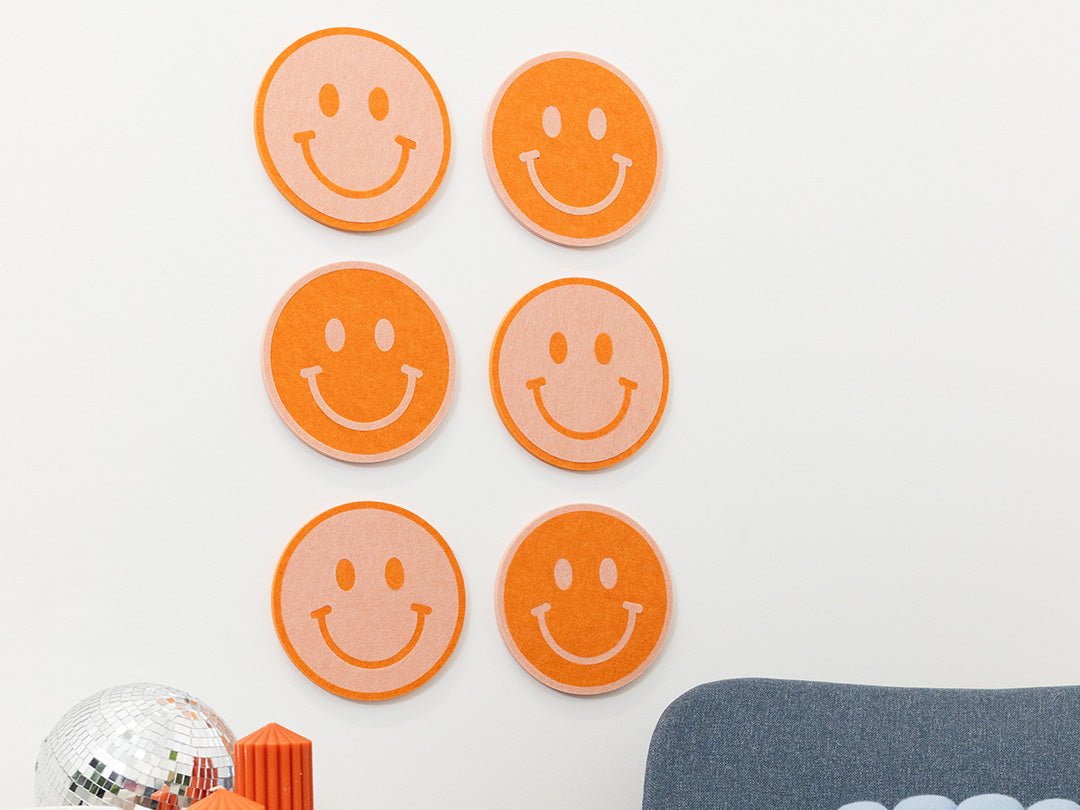 6 Smiley Face Decals on a Wall