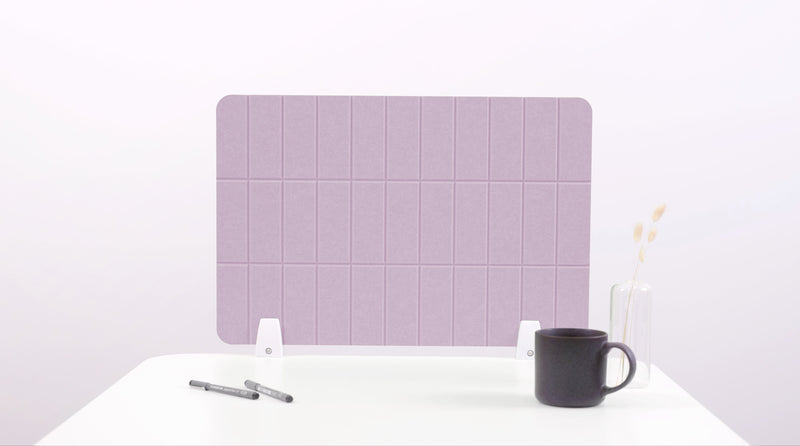 Purple placemat with grid pattern on a white surface with a black mug and pen.
