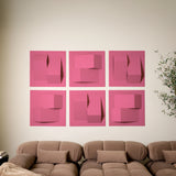 Hot pink felt tiles that have a 3D design to help with the acoustics of the room with a brown couch