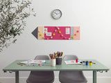 Desk with stationery items, a clock on the wall, and a decorative board with colorful pins.