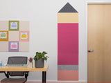 Colorful wall panels in a room with a desk and door