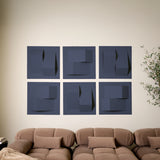 Dark blue acoustic felt tiles with peak designs on wall above the couch