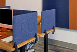 Blue desk partitions in an office setting