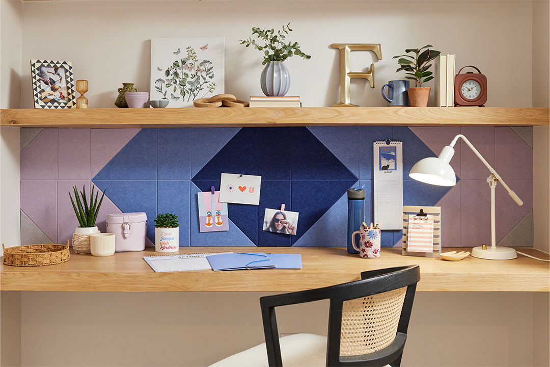 A Felt Right pinnable design in shades of blue and purple below a shelf and above a desk 