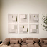 Cream acoustic felt tiles with 3D design creating peaks above a brown couch