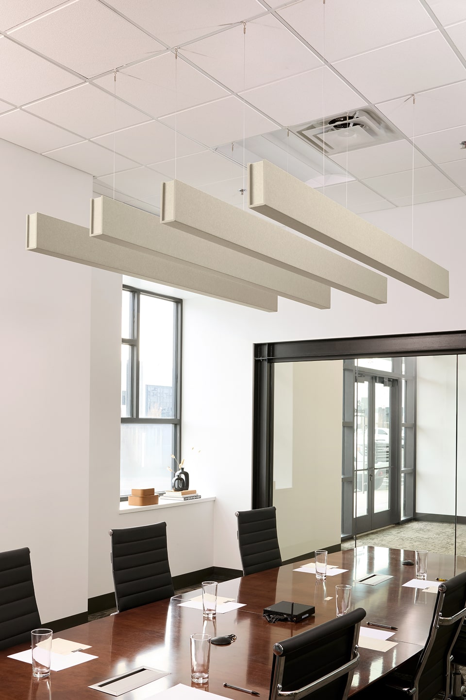 PET felt suspended acoustic beam in Ivory by Felt Right absorbs unwanted noise and looks great in any setting. Available in four or eight foot lengths. Clips into ACT grid or drills into drywall ceiling.