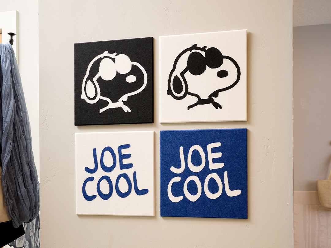 Four wall art pieces with Snoopy illustrations and 'Joe Cool' text on a light-colored wall.