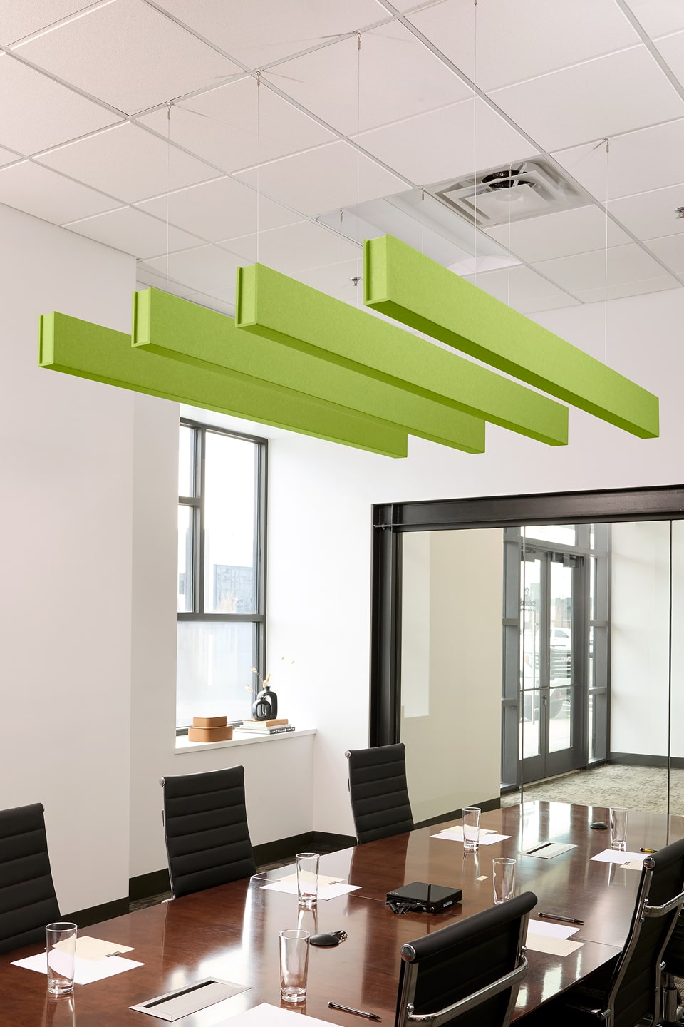 PET felt suspended acoustic beam in Kiwi by Felt Right absorbs unwanted noise and looks great in any setting. Available in four or eight foot lengths. Clips into ACT grid or drills into drywall ceiling.