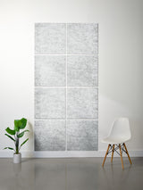 A 6-panel canvas wall art set featuring a light gray and white marble texture, displayed on a white wall in a modern room setting with a white chair and a green potted plant.