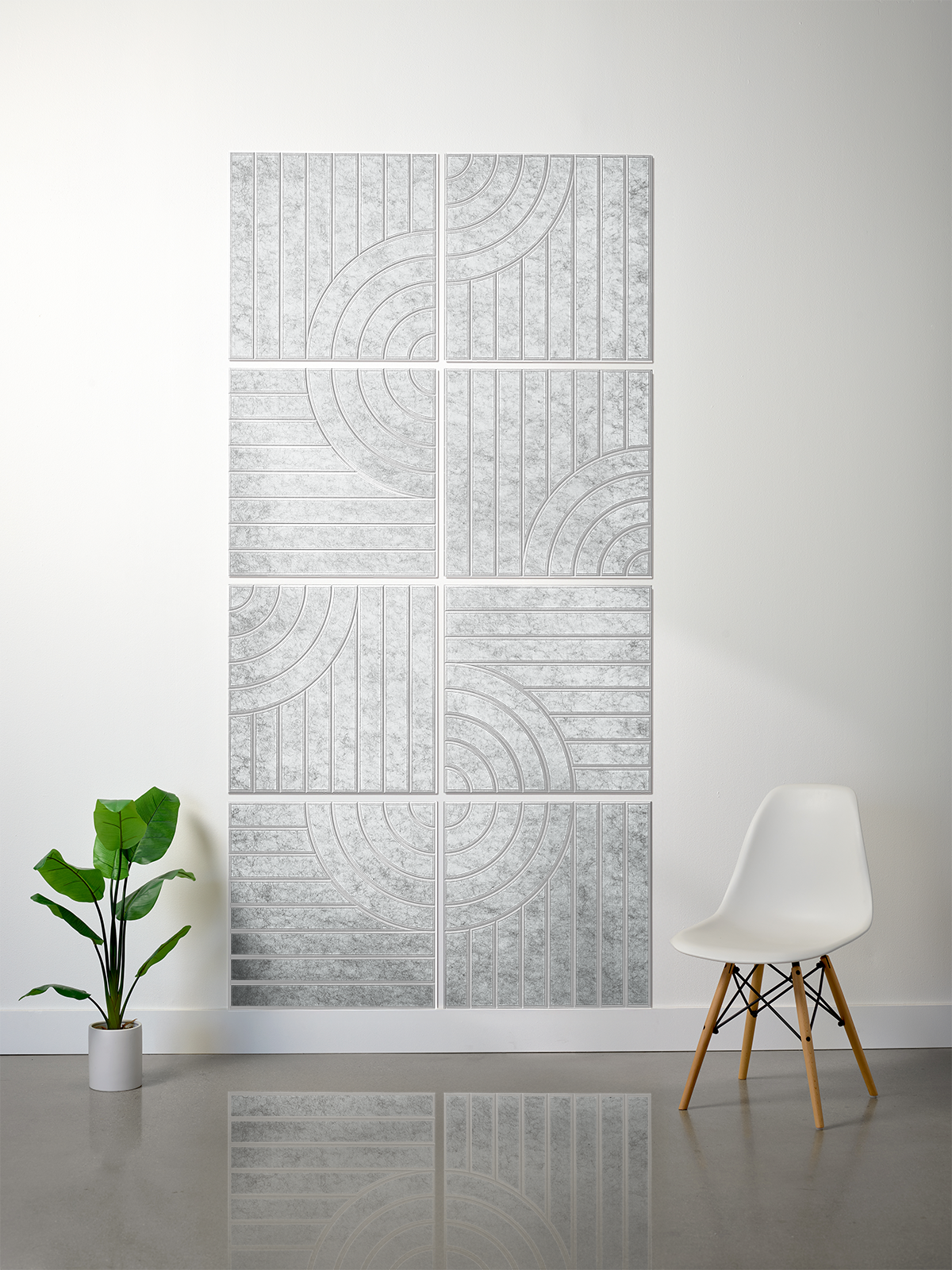Modern radiator on a white wall with a plant and chair in the foreground