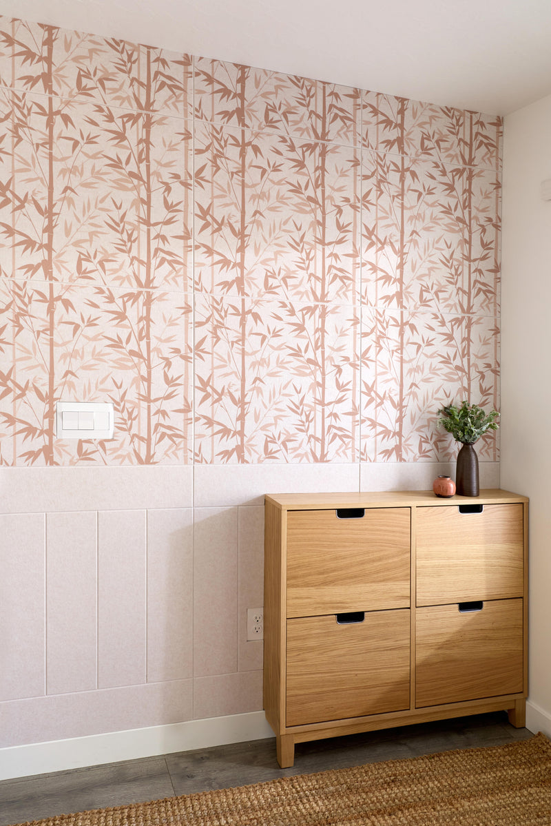 Wooden shoe cabinet against a wall with abstract patterned wallpaper