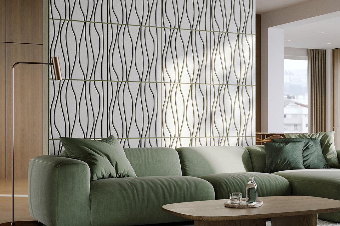 Green sofa in a modern living room with decorative acoustic wall panels and coffee table.