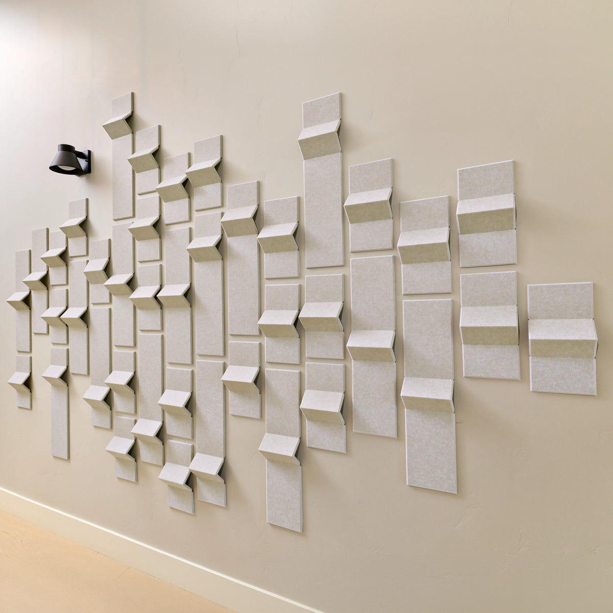 Cream felt acoustic tiles with points of dimension