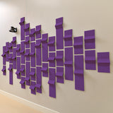 Purple acoustic felt tiles with peak dimensions on a wall