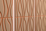 Close up of Felt Right's layered engraved acoustic wall panels in a light tan organic style.
