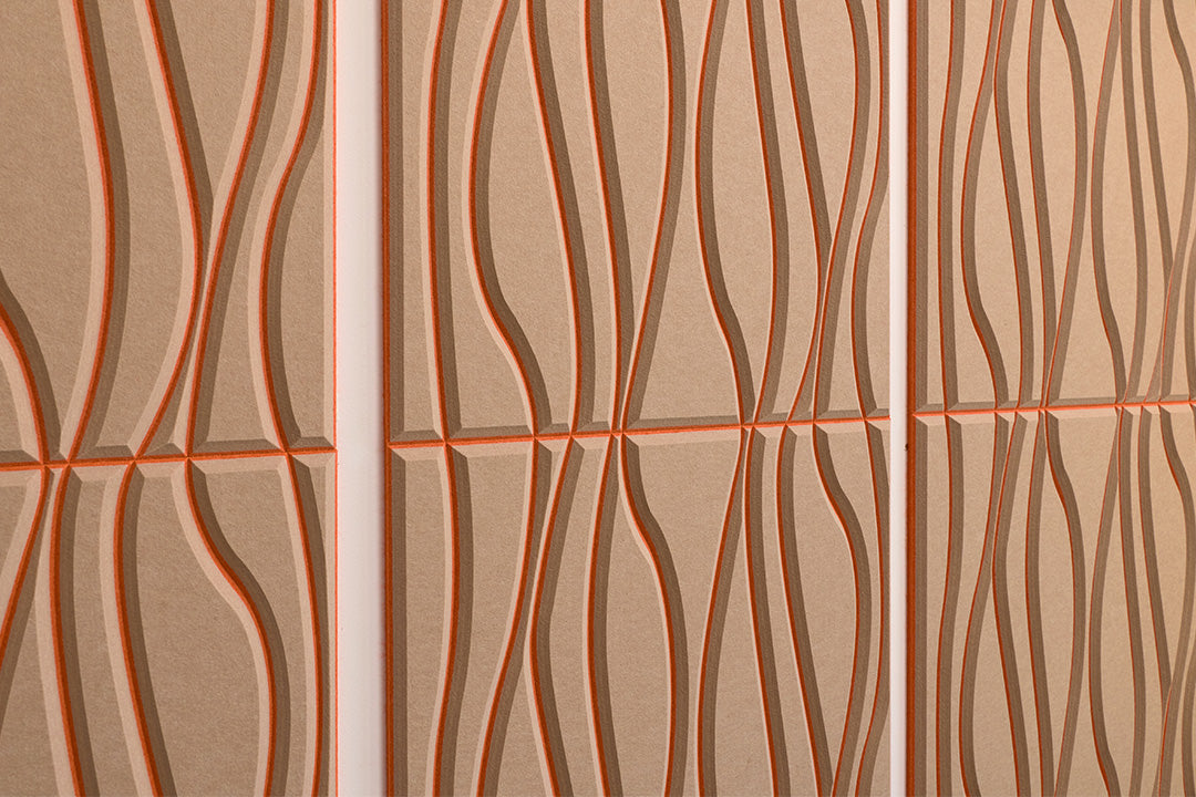 Close up of Felt Right's layered engraved acoustic wall panels in a light tan organic style.