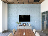 Modern conference room with blue patterned wall, wooden table, and chairs.