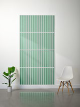 Large green felt sheet with white parallel vertical lines and horizontal divisions creating a grid pattern.