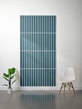 Teal felt sheet with engraved white parallel vertical lines in four horizontal sections.