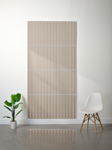 Beige felt sheet with evenly spaced parallel vertical engraved lines creating a textured grid pattern.