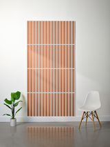 Brown and white felt sheet with parallel vertical engraved lines arranged in horizontal sections.