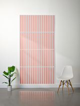 Large pink felt sheet with parallel vertical engraved lines creating a striped pattern.