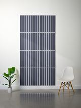 Dark felt sheet with white parallel vertical line engraving pattern and horizontal divisions creating a grid layout.