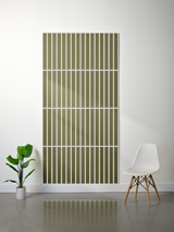 Olive-green felt sheet with parallel vertical line engravings and horizontal divisions creating a grid pattern.