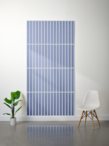 Blue felt sheet with white parallel vertical lines and horizontal dividing sections creating a grid pattern.
