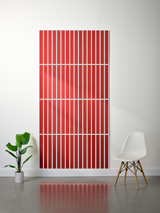 Red felt sheet with white parallel engraved lines arranged in vertical sections.