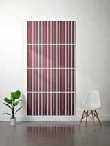 Burgundy felt sheet with white parallel engraved lines in a grid pattern, displayed on a wall.