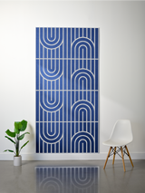 Navy blue felt sheet with white engraved geometric pattern of curved and linear designs arranged in repeating sections.