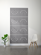 Gray felt sheet with engraved geometric arch and line pattern in four repeating sections.